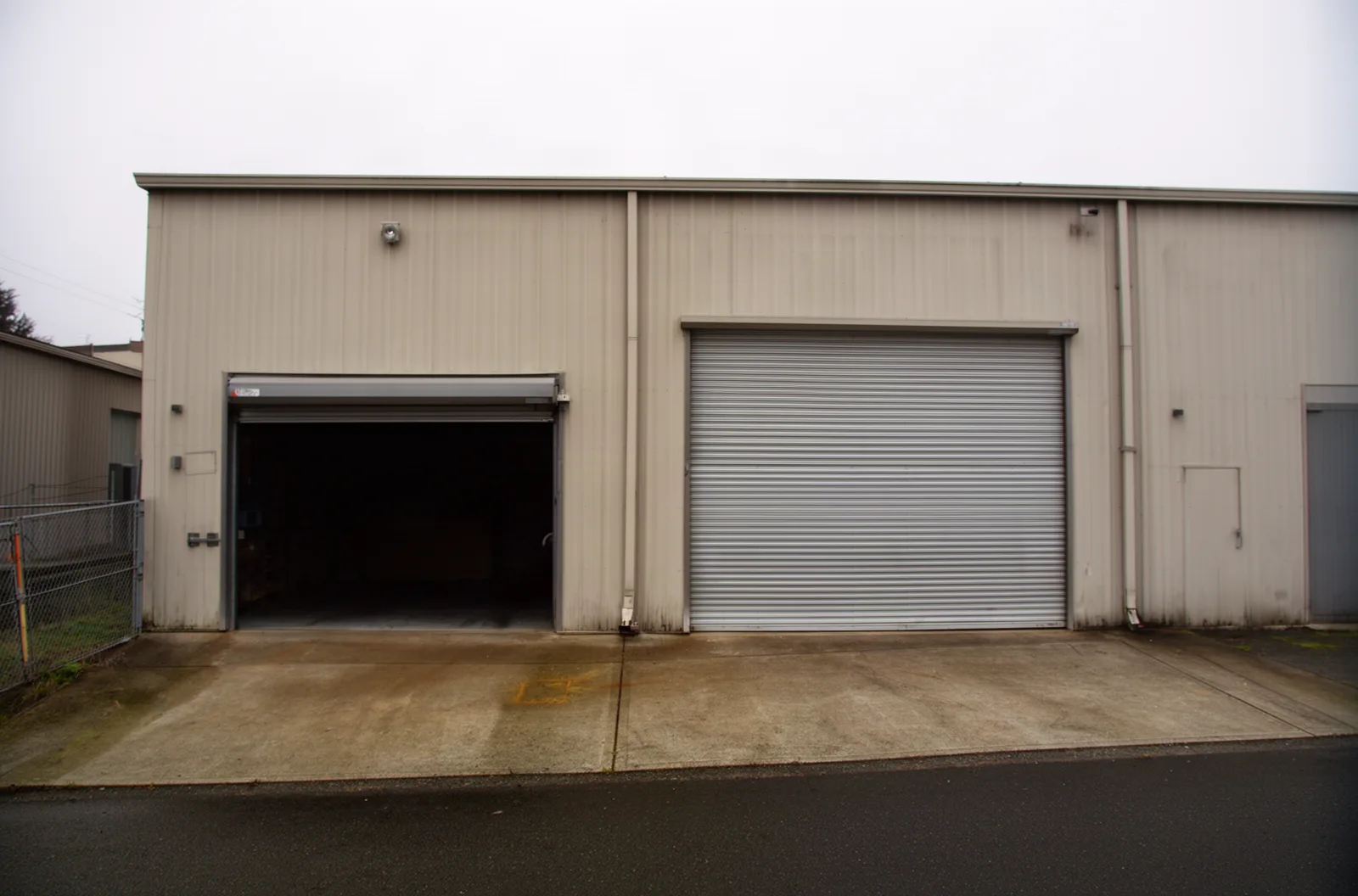 Rolling steel bay doors on a small warehouse